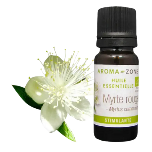 Botella de Aceite Esencial de Mirto de Aroma Zone con flor blanca y hojas verdes