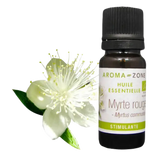 Botella de Aceite Esencial de Mirto de Aroma Zone con flor blanca y hojas verdes
